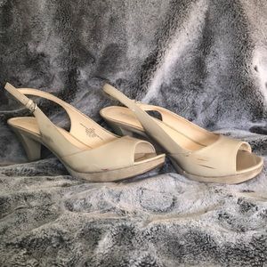 Open-toe, strap back heels.